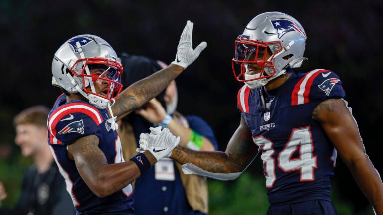 New England Patriots wide receiver Kendrick Bourne (84) celebrates with wide receiver Demario Douglas (81) after a touchdown during the second half of an NFL football game against the Philadelphia Eagles, Sunday, Sept. 10, 2023, in Foxborough, Mass.