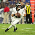Philadelphia Eagles quarterback Ian Book looks to pass against the Baltimore Ravens during the first half of a preseason NFL football game, Saturday, Aug. 12, 2023, in Baltimore.