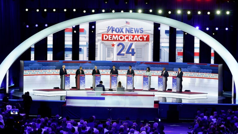 Republican presidential candidates stand at their podiums during a Republican presidential primary debate hosted by FOX News Channel.