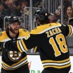 Pavel Zacha #18 of the Boston Bruins celebrates with David Pastrnak #88 after scoring a goal against the New Jersey Devils during the first period at TD Garden on April 08, 2023 in Boston, Massachusetts.
