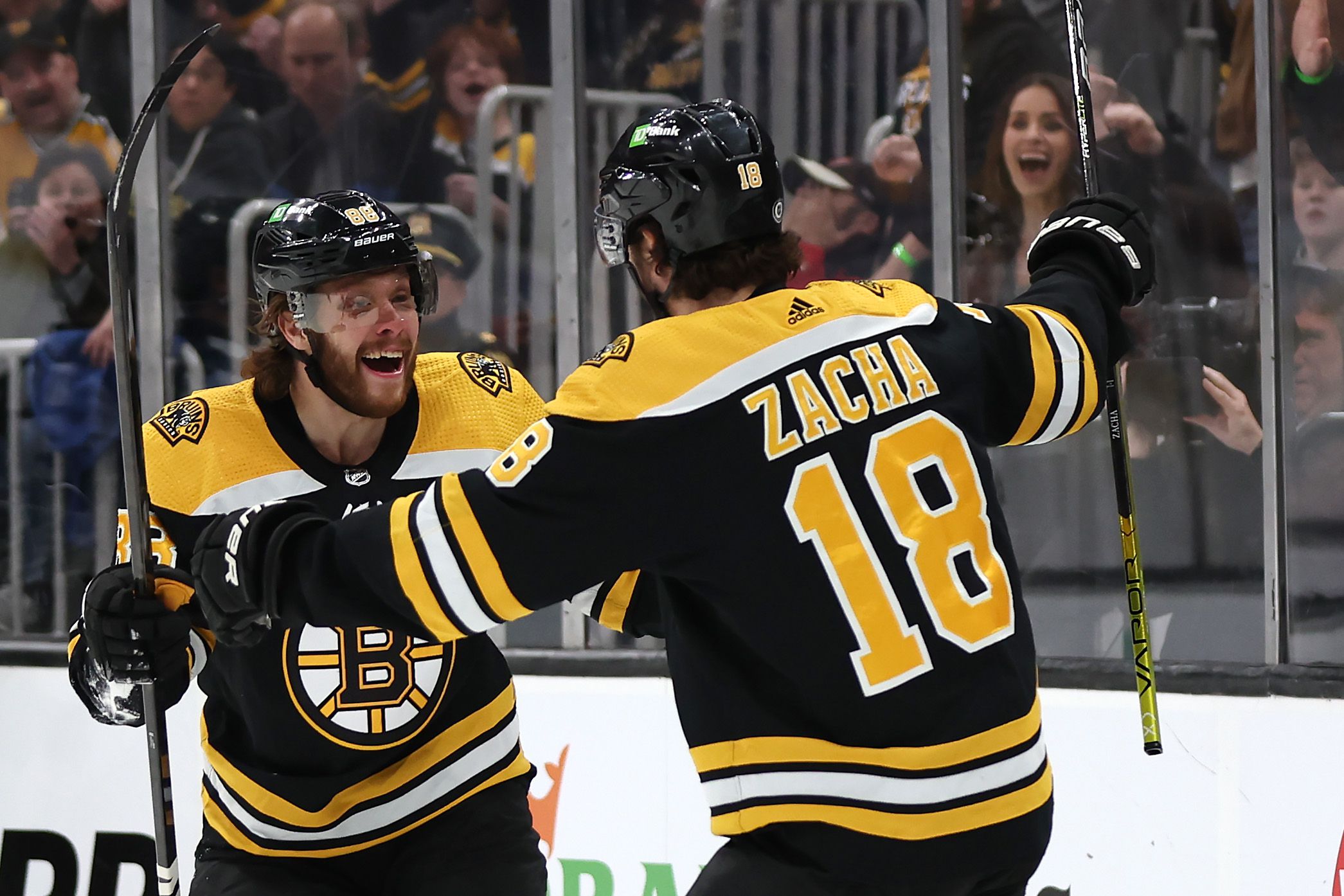 Pavel Zacha #18 of the Boston Bruins celebrates with David Pastrnak #88 after scoring a goal against the New Jersey Devils during the first period at TD Garden on April 08, 2023 in Boston, Massachusetts.