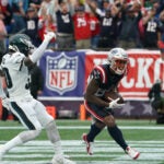 New England Patriots wide receiver Kendrick Bourne scores against Philadelphia Eagles safety Justin Evans.