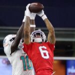 New England Patriots cornerback Christian Gonzalez (6) intercepts the ball against Miami Dolphins wide receiver Tyreek Hill (10) in the fourth quarter. The New England Patriots hosted the Miami Dolphins in an NFL game on Sept. 17 at Gillette Stadium in Foxborough.