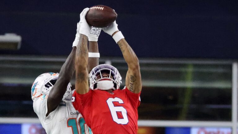 New England Patriots cornerback Christian Gonzalez (6) intercepts the ball against Miami Dolphins wide receiver Tyreek Hill (10) in the fourth quarter. The New England Patriots hosted the Miami Dolphins in an NFL game on Sept. 17 at Gillette Stadium in Foxborough.