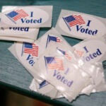 I Voted stickers sit on the table at Hyde Community Center.