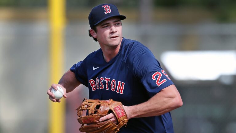 Joe Kelly, suspended Boston Red Sox pitcher, watches from bleachers