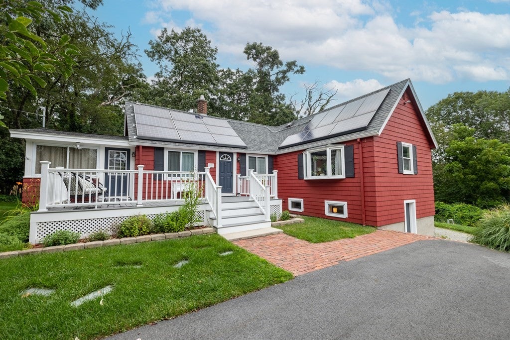 Home for sale in Lynn with red siding. 