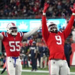 New England Patriots linebacker Matthew Judon (9) and New England Patriots linebacker Josh Uche (55) celebrate after Miami Dolphins quarterback Tua Tagovailoa (1) was sacked in the third quarter. The New England Patriots hosted the Miami Dolphins in an NFL game on Sept. 17 at Gillette Stadium in Foxborough.