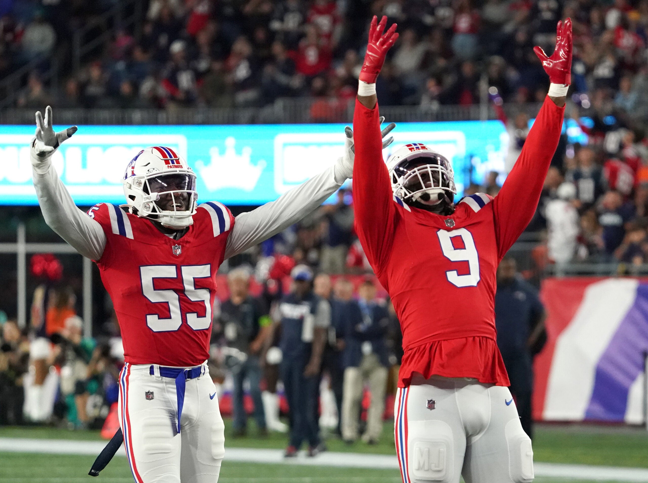 New England Patriots linebacker Matthew Judon (9) and New England Patriots linebacker Josh Uche (55) celebrate after Miami Dolphins quarterback Tua Tagovailoa (1) was sacked in the third quarter. The New England Patriots hosted the Miami Dolphins in an NFL game on Sept. 17 at Gillette Stadium in Foxborough.