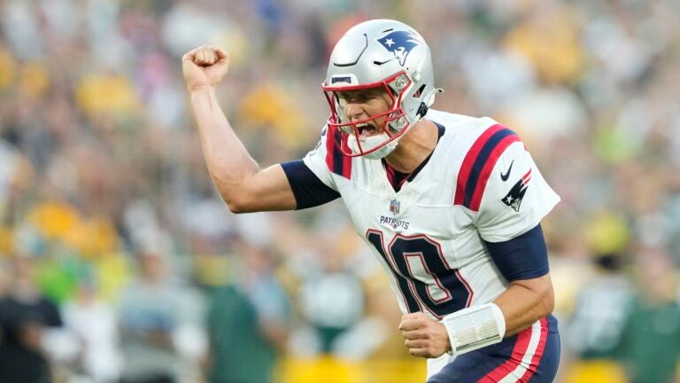 GREEN BAY, WISCONSIN - AUGUST 19: Mac Jones #10 of the New England Patriots celebrates after a touchdown in the first quarter against the Green Bay Packers during a preseason game at Lambeau Field on August 19, 2023 in Green Bay, Wisconsin.