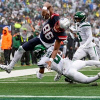New England Patriots tight end Pharaoh Brown (86) pushes for the end zone against New York Jets safety Adrian Amos (0) to score a touchdown during the second quarter of an NFL football game, Sunday, Sept. 24, 2023, in East Rutherford, N.J.