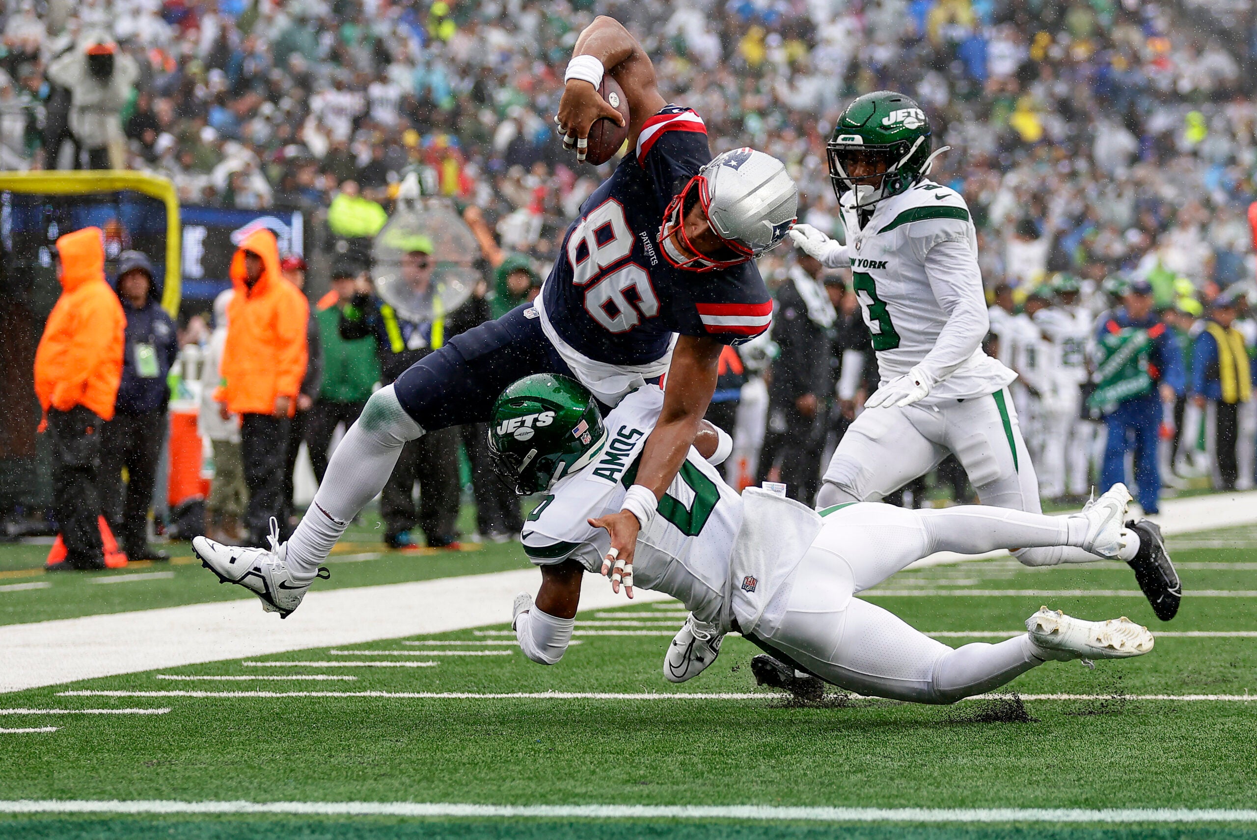 New England Patriots tight end Pharaoh Brown (86) pushes for the end zone against New York Jets safety Adrian Amos (0) to score a touchdown during the second quarter of an NFL football game, Sunday, Sept. 24, 2023, in East Rutherford, N.J.