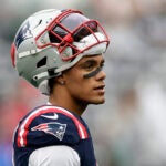 New England Patriots cornerback Christian Gonzalez (6) walks on the field before playing against the New York Jets in an NFL football game, Sunday, Sept. 24, 2023, in East Rutherford, N.J.