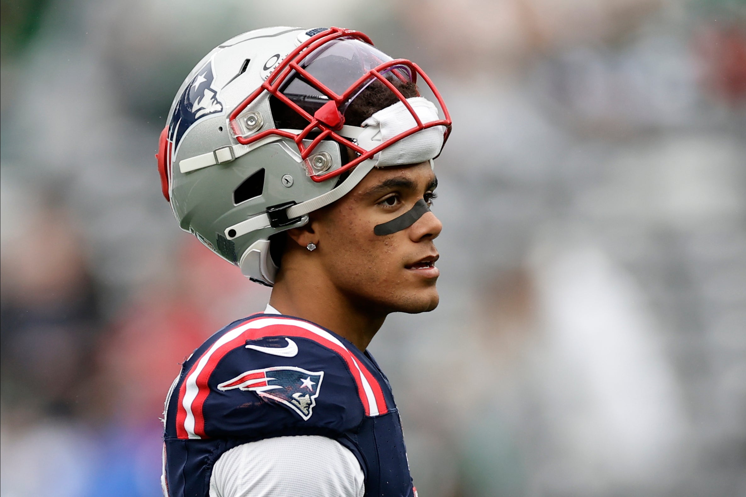 New England Patriots cornerback Christian Gonzalez (6) walks on the field before playing against the New York Jets in an NFL football game, Sunday, Sept. 24, 2023, in East Rutherford, N.J.