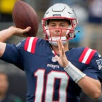 New England Patriots quarterback Mac Jones (10) warms up before an NFL football game against the New York Jets on Sunday Sept. 24, 2023, in New York.