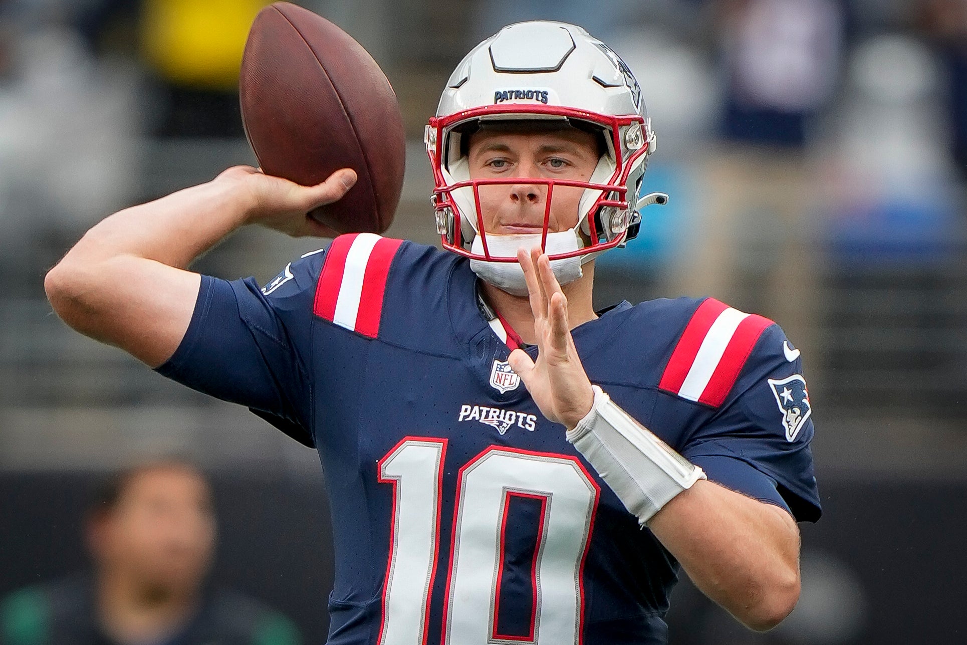 New England Patriots quarterback Mac Jones (10) warms up before an NFL football game against the New York Jets on Sunday Sept. 24, 2023, in New York.