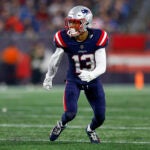 New England Patriots defensive back Jack Jones, prepares to defend during the first half of an NFL pre-season football game against the Houston Texans, Aug. 10, 2023, in Foxborough, Mass. Jones has agreed Tuesday, Sept. 5, to serve one year of probation and 48 hours of community service in exchange for prosecutors dropping eight of the nine weapons charges he faced in connection with his June arrest at a Boston Logan Airport security checkpoint for allegedly having two loaded guns in his carry-on bag.