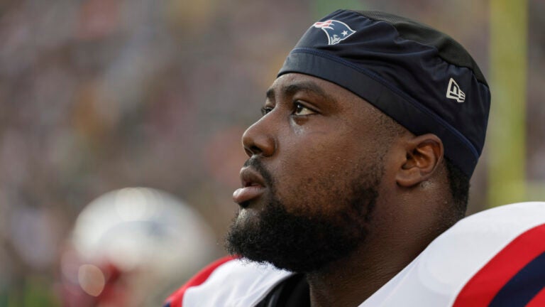 New England Patriots defensive tackle Christian Barmore (90) participates in warmups during a preseason NFL football game between the New England Patriots and Green Bay Packers Saturday, Aug. 19, 2023, in Green Bay, Wis.