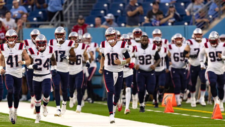 New England Patriots quarterback Mac Jones (10) leads his team onto the field before their NFL football game against the Tennessee Titans Friday, Aug. 25, 2023, in Nashville, Tenn.