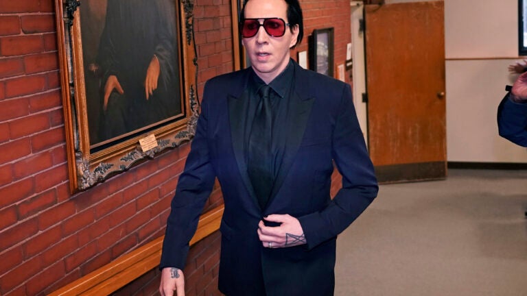 Musical artist Marilyn Manson leaves after appearing in Belknap Superior Court.