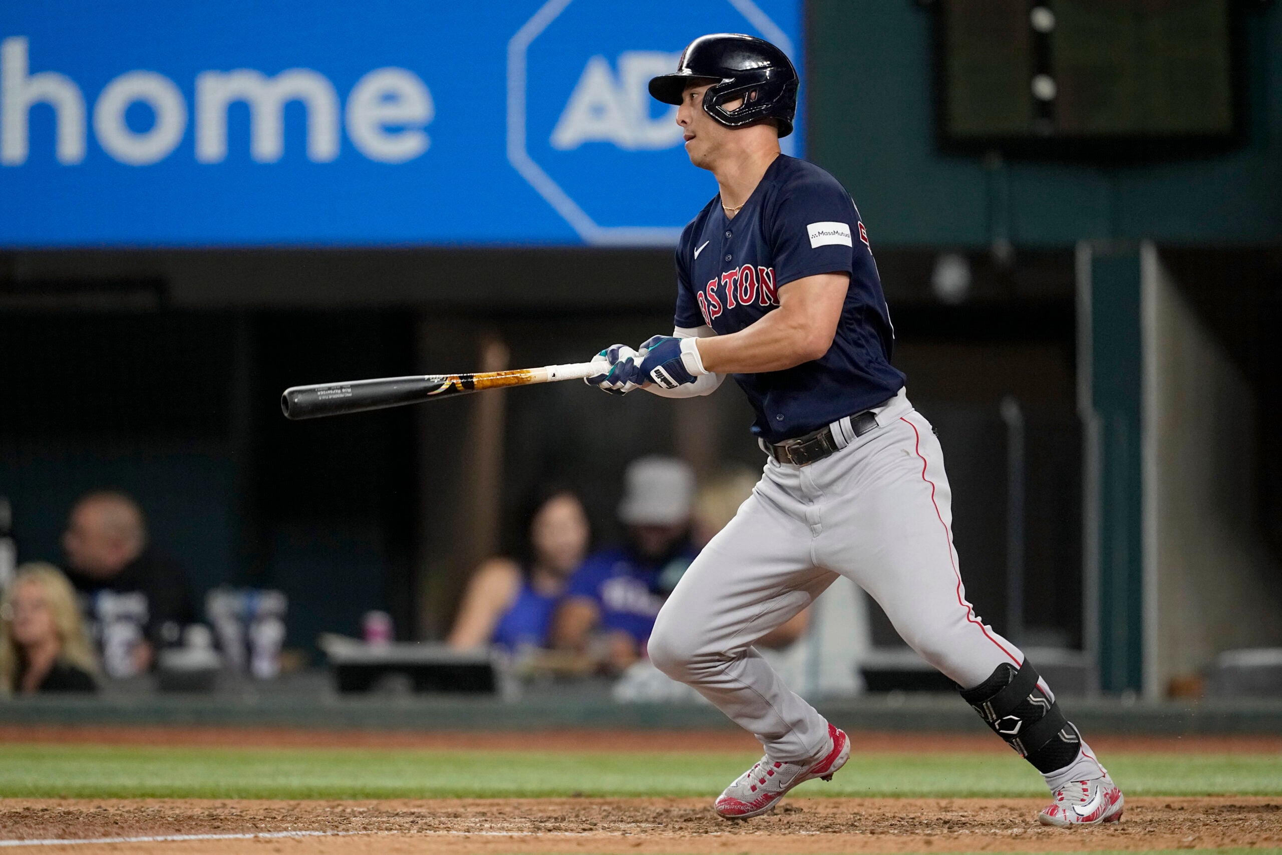 Rob Refsnyder of the Red Sox follows through on a two-run single in the eighth inning.