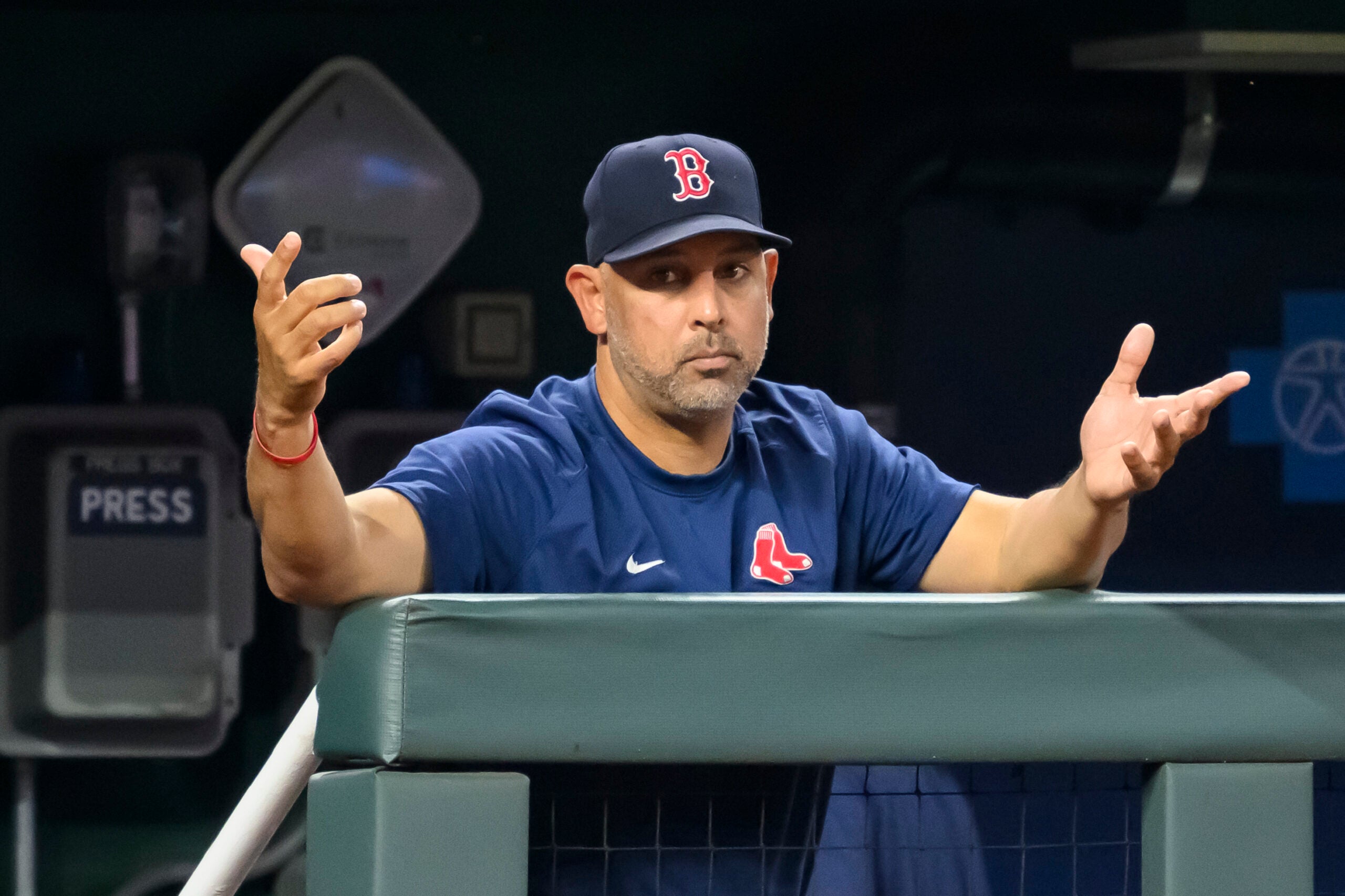 Boston Red Sox manager Alex Cora gestures to the home plate umpire during the sixth inning of a baseball game against the Kansas City Royals, Saturday, Sept. 2, 2023, in Kansas City, Mo.