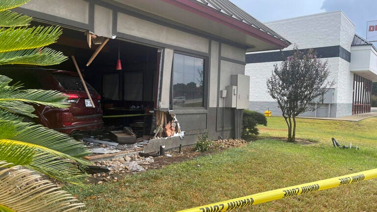 This image provided by the Rosenberg Police Department shows police tape in front of a Denny's restaurant after a vehicle crashed into it in Rosenberg, Texas, Monday, Sept. 4, 2023.