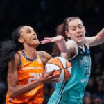 Connecticut Sun forward DeWanna Bonner attacks the rim against New York Liberty forward Breanna Stewart.