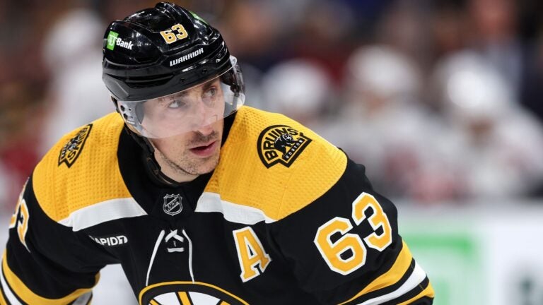 Brad Marchand #63 of the Boston Bruins looks on during the third period against the Washington Capitals at TD Garden on April 11, 2023 in Boston, Massachusetts. The Bruins defeat the Capitals 5-2, setting the new NHL record for most points in a single season with 133.