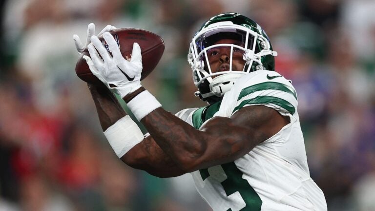 Cornerback Sauce Gardner #1 of the New York Jets intercepts a pass from the Buffalo Bills during the second quarter of the NFL game at MetLife Stadium on September 11, 2023 in East Rutherford, New Jersey.