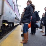 A commuter waits for the commuter rail.