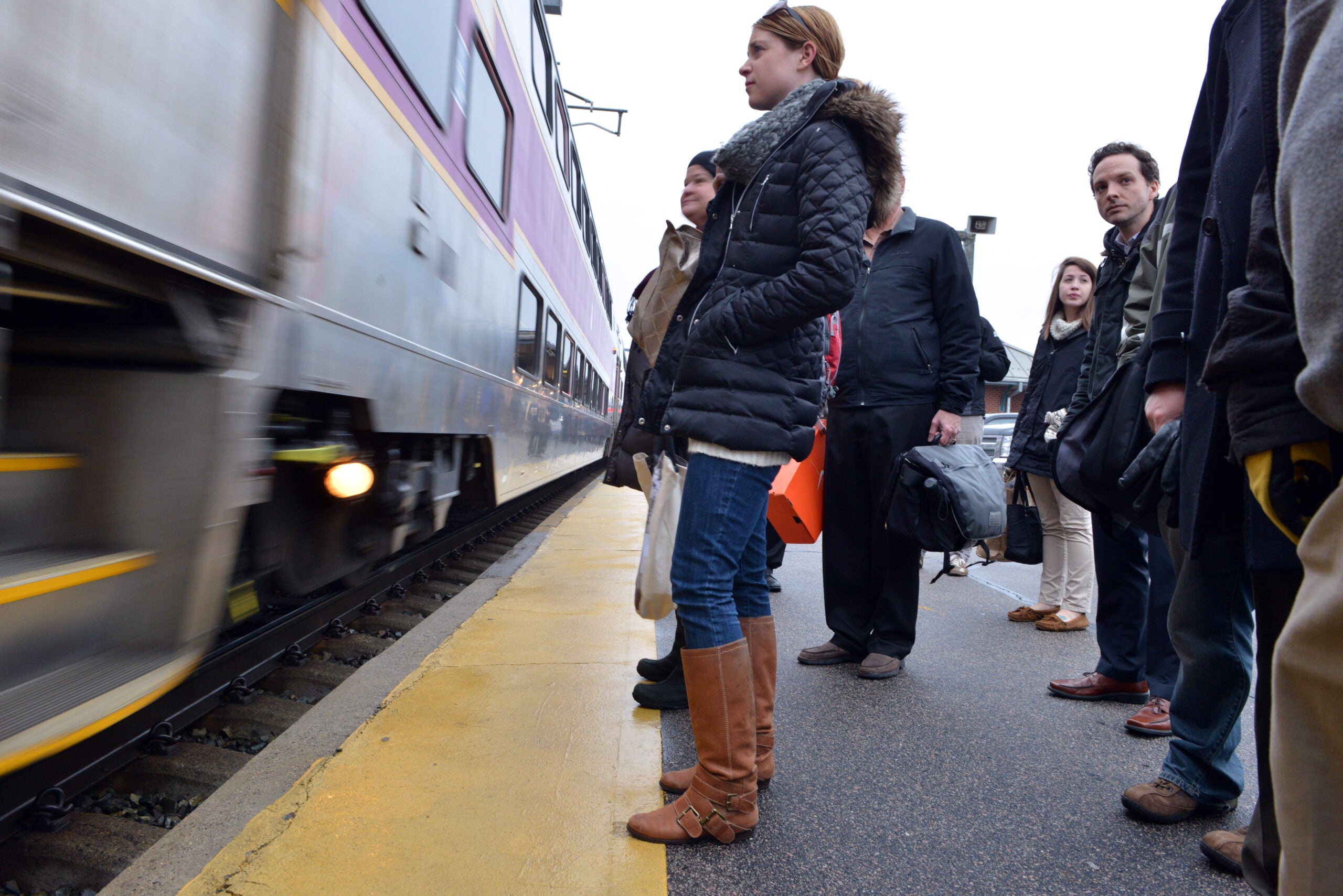 A commuter waits for the commuter rail.