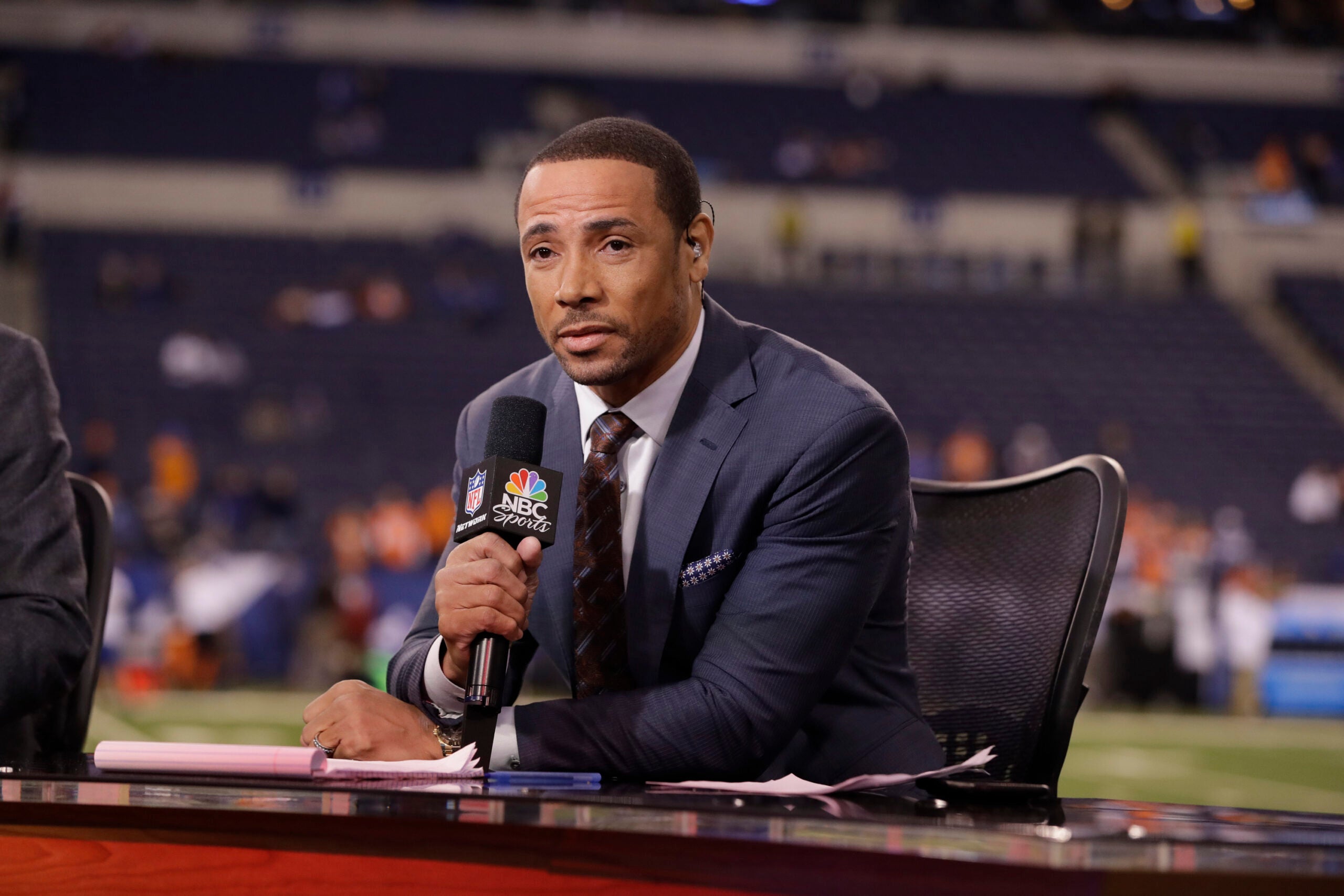 Analyst Rodney Harrison talks on set before an NFL football game between the Indianapolis Colts and Denver Broncos in Indianapolis, Thursday, Dec. 14, 2017.