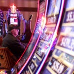 A man plays one of the slot machines in the MGM Springfield Casino in Massachusetts.