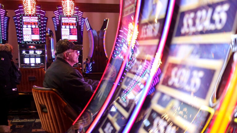 A man plays one of the slot machines in the MGM Springfield Casino in Massachusetts.
