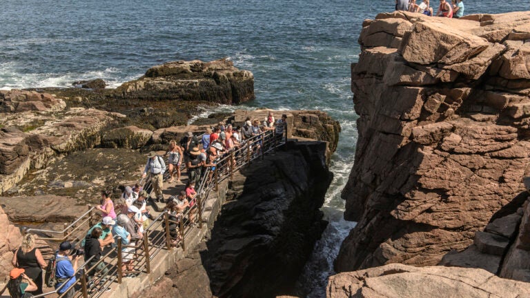 Visitors crowd a walkway at Thunder Hole in Acadia National Park in Maine in 2021.