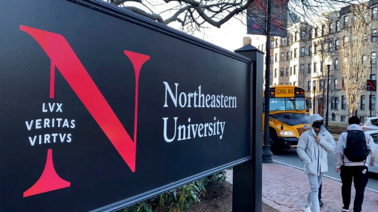 A picture of a black Northeastern University campus sign.