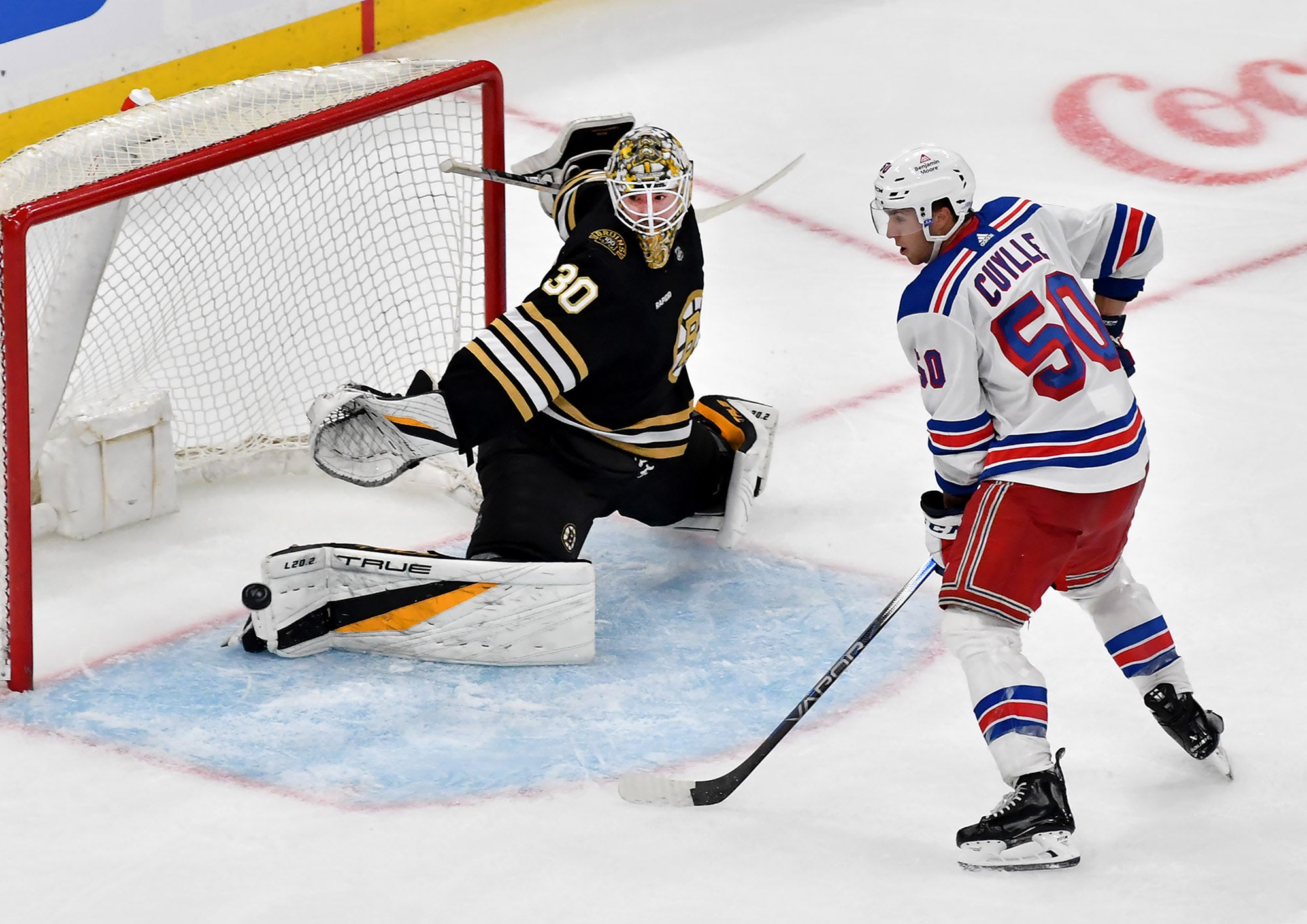 Boston Bruins’ goalie Brandon Bussi blocks a goal attempt by New York Rangers’ Will Cuylle (50) during the third period of an NHL exhibition game at TD Garden in Boston, Sunday, Sept. 24, 2023.