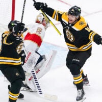 Boston Bruins left wing Brad Marchand (63) and Boston Bruins center Pavel Zacha (18) celebrate his goal for a 2-0 lead during the second period. The Boston Bruins host the Florida Panthers in Game 1 of the Stanley Cup Playoffs on April 18, 2023 at TD Garden in Boston, MA.