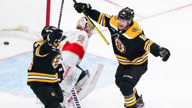 Boston Bruins left wing Brad Marchand (63) and Boston Bruins center Pavel Zacha (18) celebrate his goal for a 2-0 lead during the second period. The Boston Bruins host the Florida Panthers in Game 1 of the Stanley Cup Playoffs on April 18, 2023 at TD Garden in Boston, MA.
