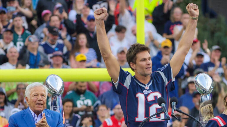 Tom Brady speaking during a half time celebration in Brady’s honor as team owner Robert Kraft applaudes during their game against the Philadelphia Eagles at Gillette Stadium. 