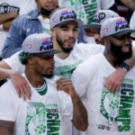 Boston Celtics Marcus Smart, Jayson Tatum, and Jaylen Brown (7) after they defeated the Miami Heat 100-96 winning game 7 of the NBA Eastern Conference Finals at FTX Arena.