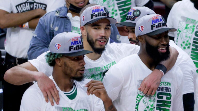 Boston Celtics Marcus Smart, Jayson Tatum, and Jaylen Brown (7) after they defeated the Miami Heat 100-96 winning game 7 of the NBA Eastern Conference Finals at FTX Arena.