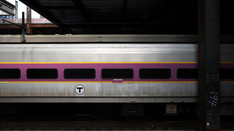 A photo of an MBTA commuter rail train passing by.