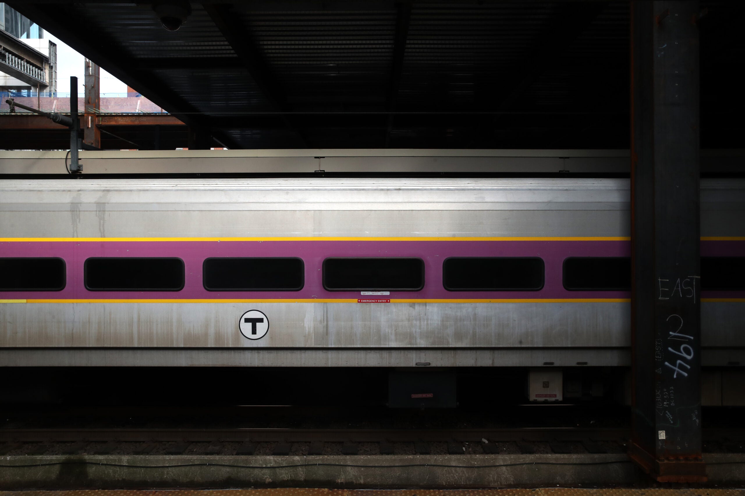 A photo of an MBTA commuter rail train passing by.