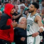 The Celtics Jayson Tatum gets a hand from NBA Hall of Famer Paul Pierce as he leaves the game. New England Patriots owner Robert Kraft is in between them. The Boston Celtics hosted the Milwaukee Bucks for Game Seven of their NBA basketball Eastern Conference Semi-Final Playoff series at the TD Garden.