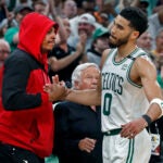 The Celtics Jayson Tatum gets a hand from NBA Hall of Famer Paul Pierce as he leaves the game. New England Patriots owner Robert Kraft is in between them. The Boston Celtics hosted the Milwaukee Bucks for Game Seven of their NBA basketball Eastern Conference Semi-Final Playoff series at the TD Garden.