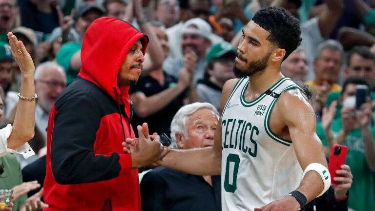 The Celtics Jayson Tatum gets a hand from NBA Hall of Famer Paul Pierce as he leaves the game. New England Patriots owner Robert Kraft is in between them. The Boston Celtics hosted the Milwaukee Bucks for Game Seven of their NBA basketball Eastern Conference Semi-Final Playoff series at the TD Garden.