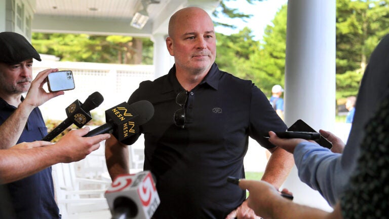 The Boston Bruins held their annual charity golf tournament at the Pinehills Golf Course. Coach Jim Montgomery chats with reporters.