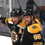 Boston Bruins right wing David Pastrnak (88)(rt) is congratulated by Boston Bruins left wing Brad Marchand (63) after Pastrnak’s 1st period goal.